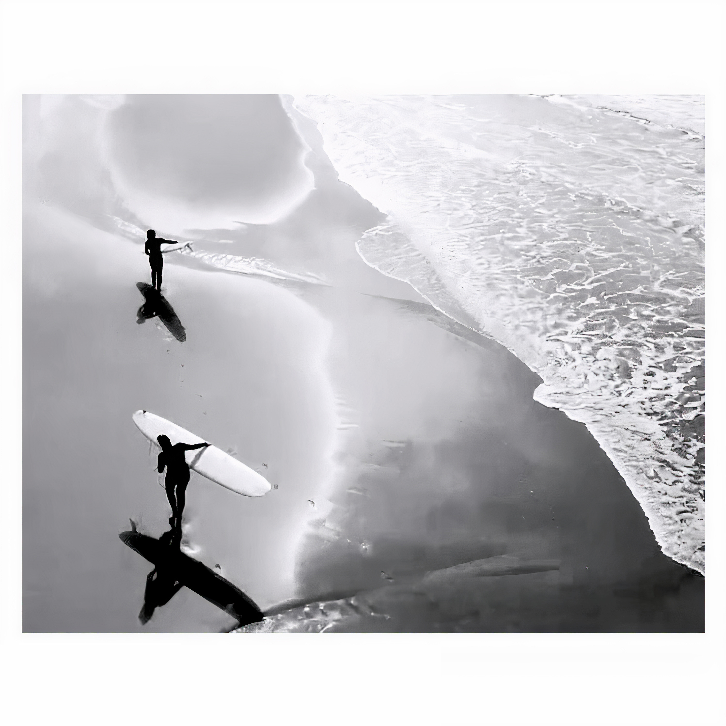 Aerial view of surfers walking on beach with surfboards, black and white